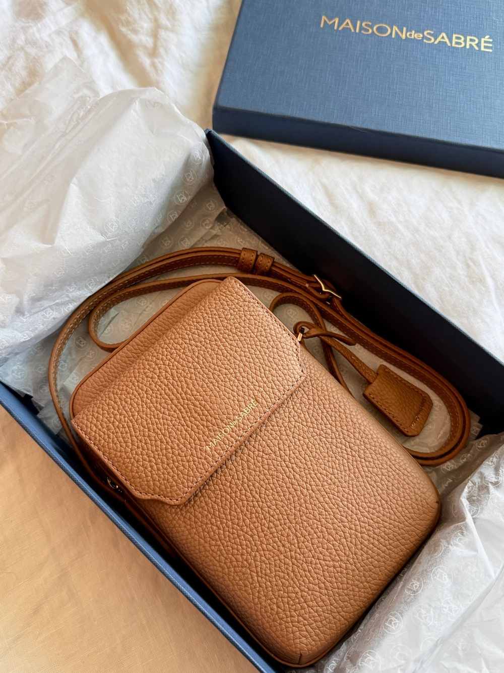 Maison de Sabré The Zipped Phone Pouch Leather Crossbody Bag in Sandstone Brown